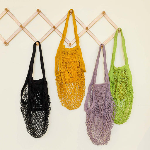 Variety colors of the ami net market tote by Graf Lantz. Hanging pocket netted tote bag.