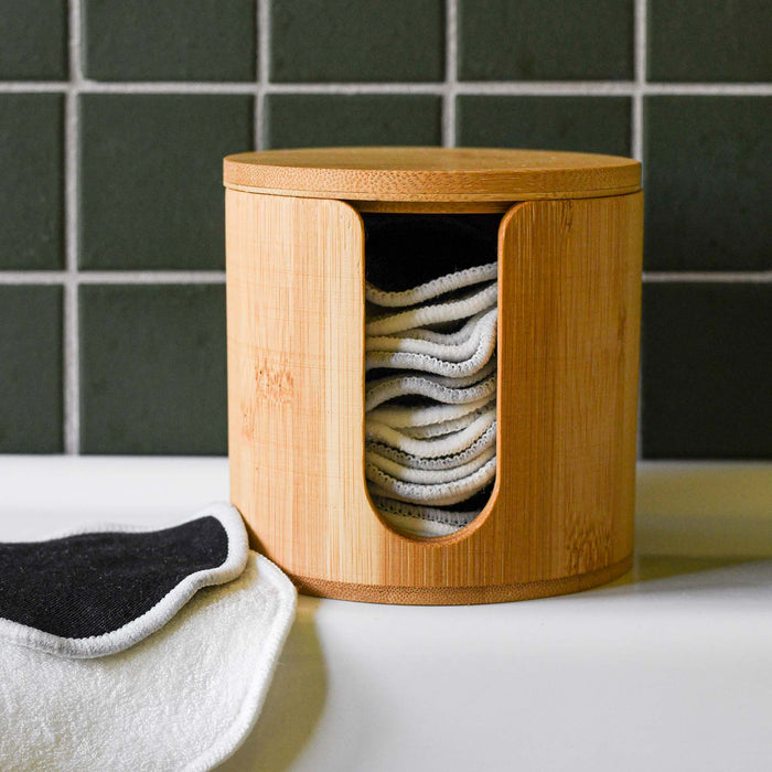 Bamboo facial rounds holder with lid for storage.