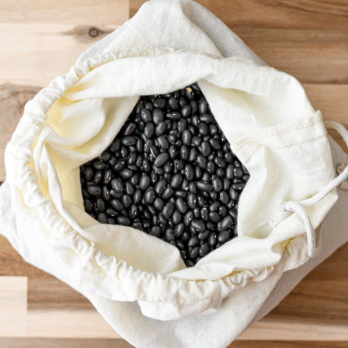 Muslin organic cotton produce bag with beans.