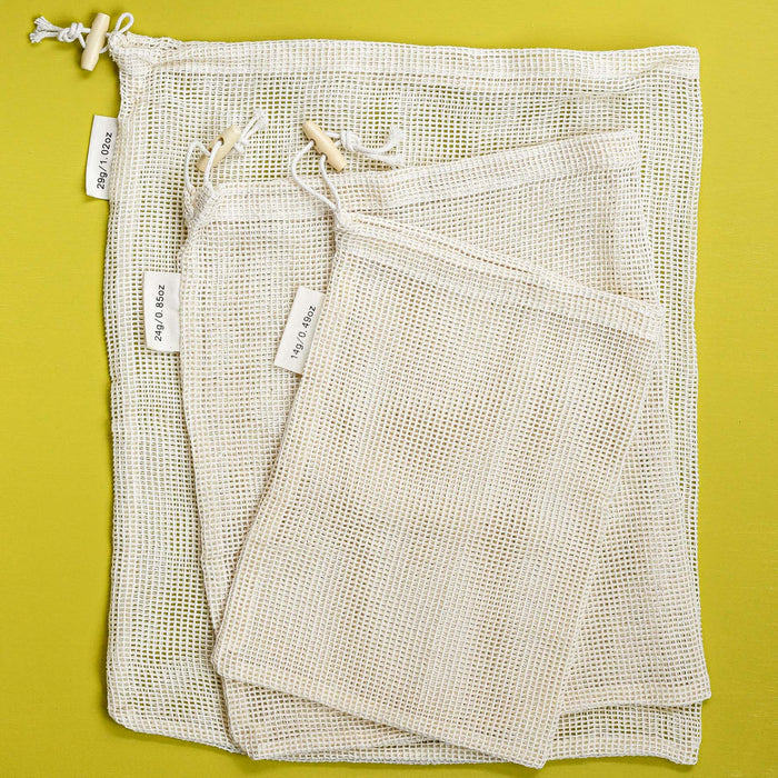 Set of 3 organic cotton mesh drawstring close produce bags with tare weight values.