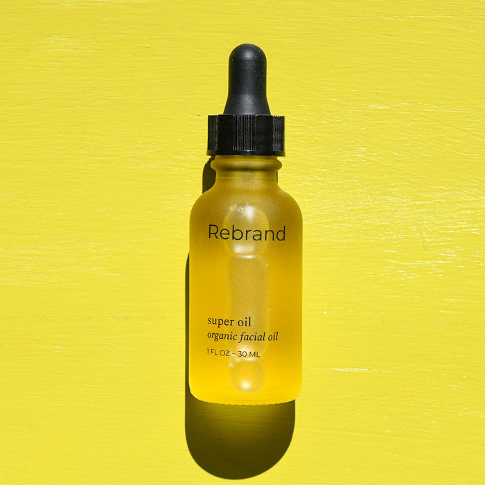 Glass dropper bottle with organic facial oil from Rebrand.