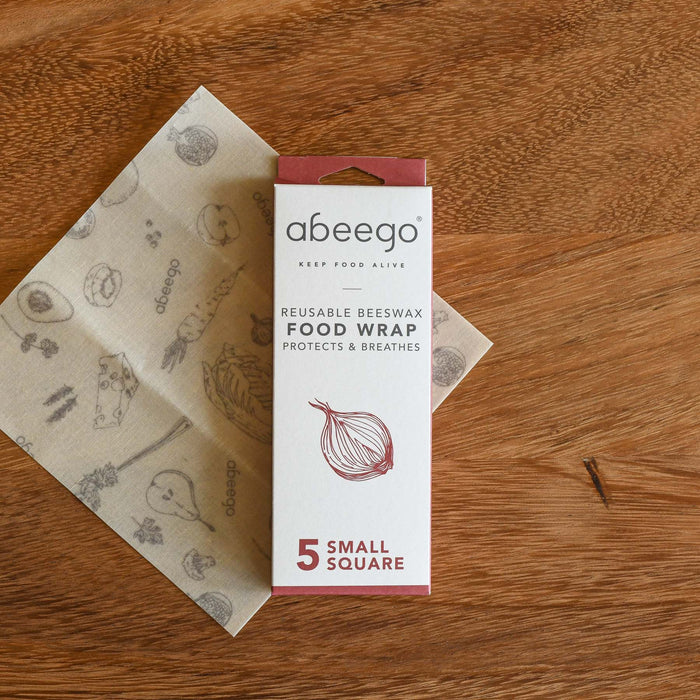 Small square beeswax wrap. Packaging and the product unwrapped. From Abeego.