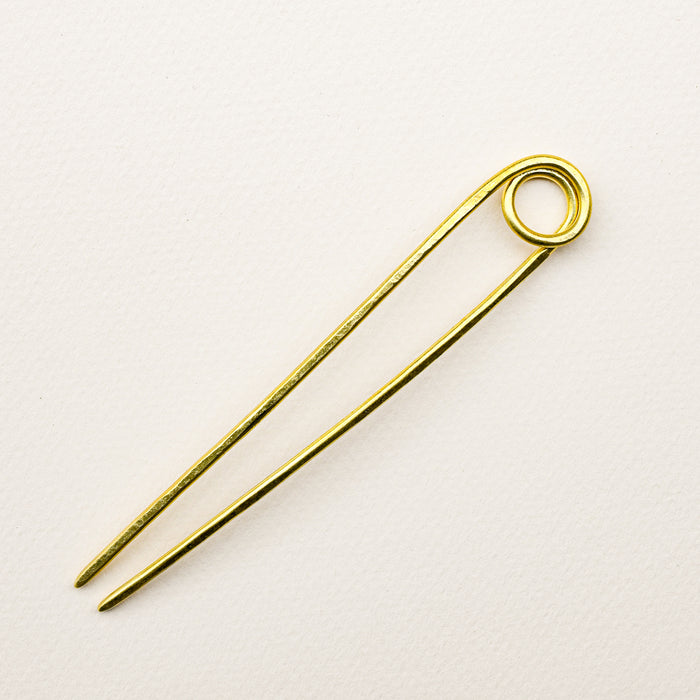 Handmade le loop brass bun pin.
