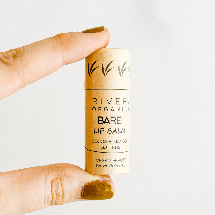 Vegan lip balm. Mousterizing coca and mango butters. Compostable packaging. from River Organics. Made in Wilmington, NC.