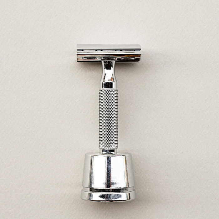 Rockwell razor stand with matching white chrome razor.