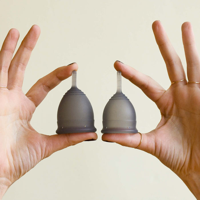 Regular and small silicone menstrual cups for size comparison. From Saalt.