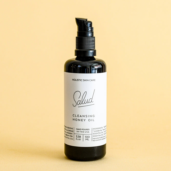 Salud cleansing honey oil in black glass jar.
