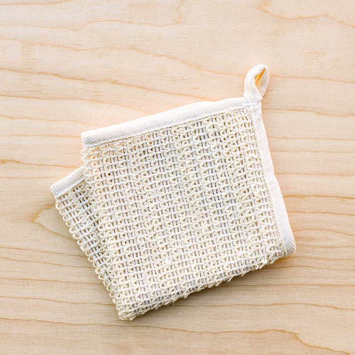 Sisal washcloth with cotton loop for drying.