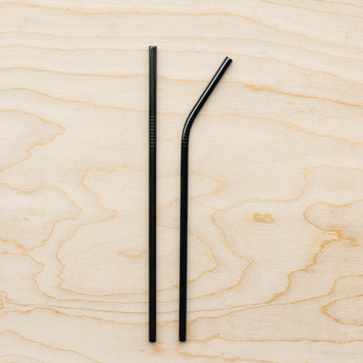 Black stainless steel straws in bent and straight form. 
