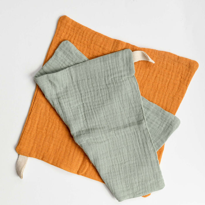 Sage and yellow set of organic cotton muslin washcloth with hanging loop.