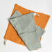 Sage and yellow set of organic cotton muslin washcloth with hanging loop.