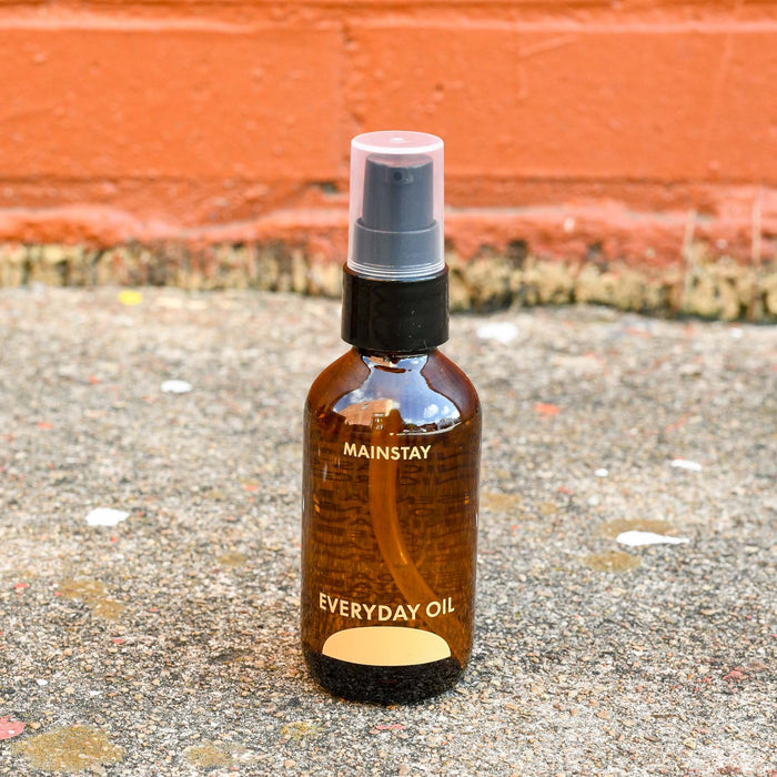 Mainstay Everyday Oil made in Asheville, NC in travel size glass amber bottle.