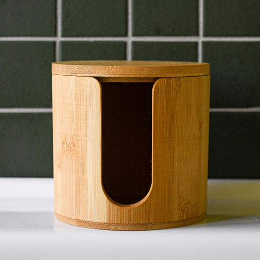 Bamboo facial rounds holder with lid for storage.