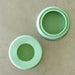 Reusable silicone food hugger sprout lid separated into the draining dish and the perforated sprouted top. 