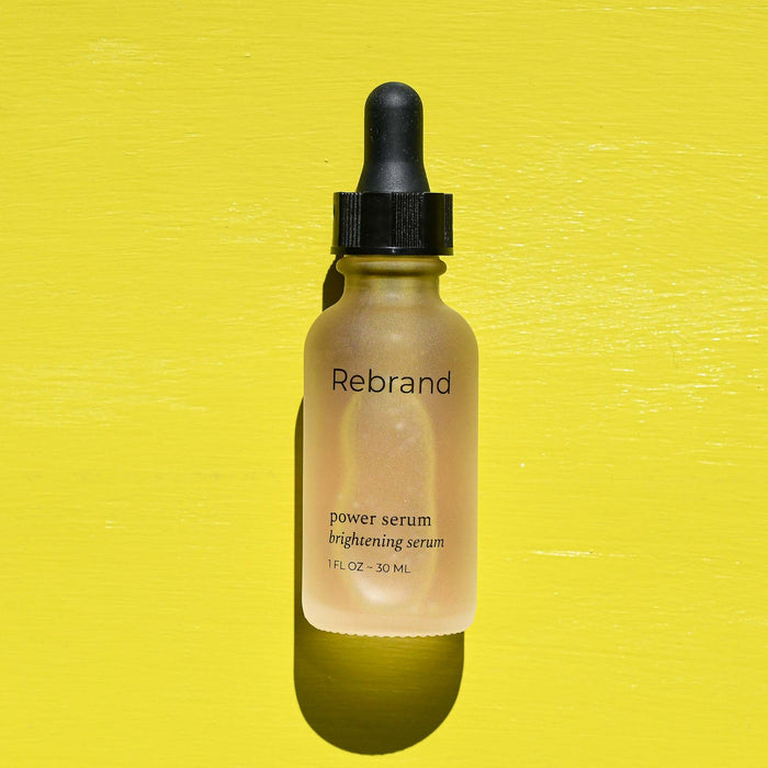 Glass dropper bottle with brightening serum from Rebrand. 