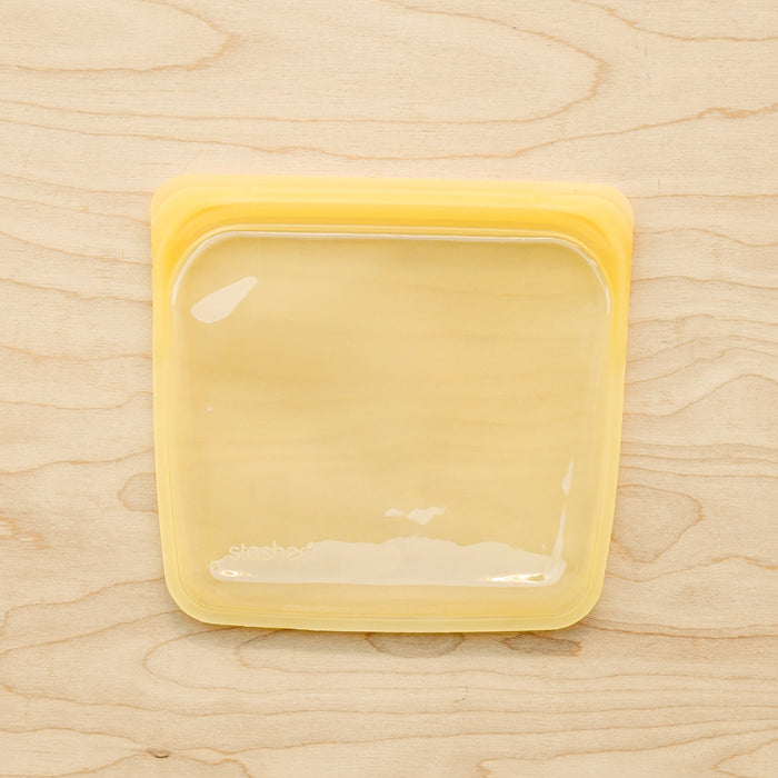 Stasher silicone medical and food grade safe reusable plastic bags. Sandwich flat bags in Yellow. 