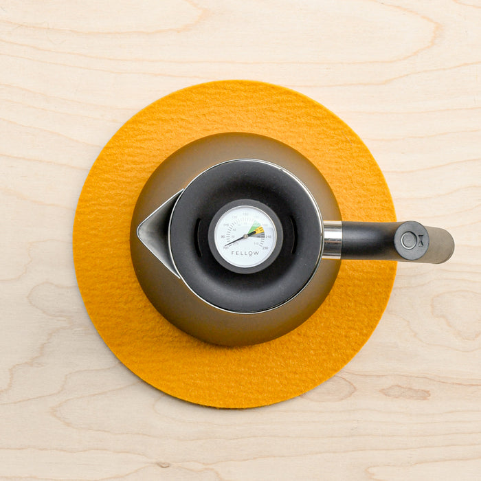 Turmeric wool felted trivet by Graf Lantz with Fellow tea kettle.