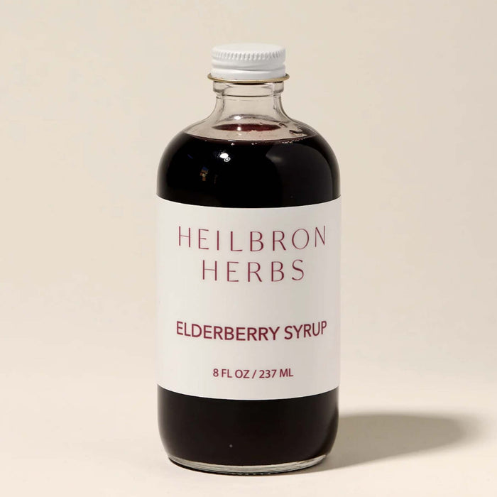 Glass bottle of elderberry syrup made in WNC. Marshall, NC. From Heilbron Herbs. 