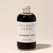 Glass bottle of elderberry syrup made in WNC. Marshall, NC. From Heilbron Herbs. 