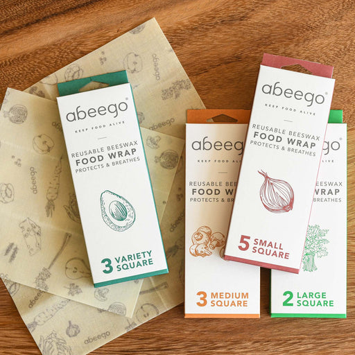 All 4 beeswax wrap boxes with small and medium unboxed sheets of beeswax wrap. From Abeego.