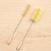 Agave fiber bottle brushes. One narrow, one standard size. Metal stems and hooks at the end.