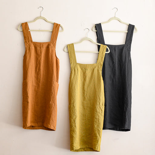Linen pinafore apron in various colors.