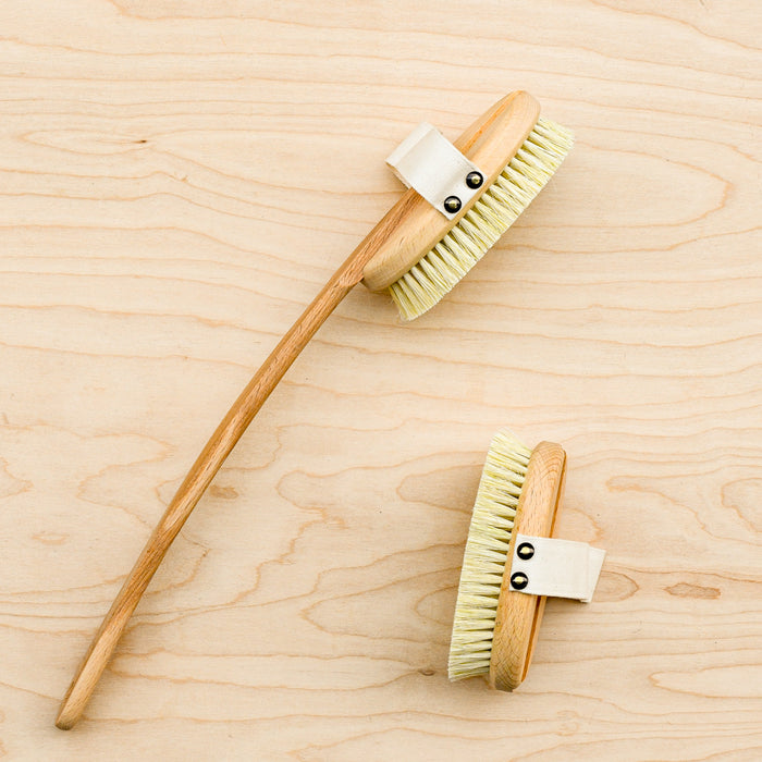 Bath brush with an attached handle. Bath brush without handle attached. Cotton back strap for hands.