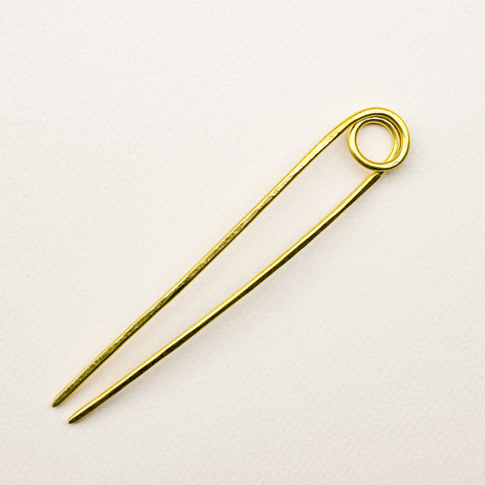 Handmade le loop brass bun pin. 