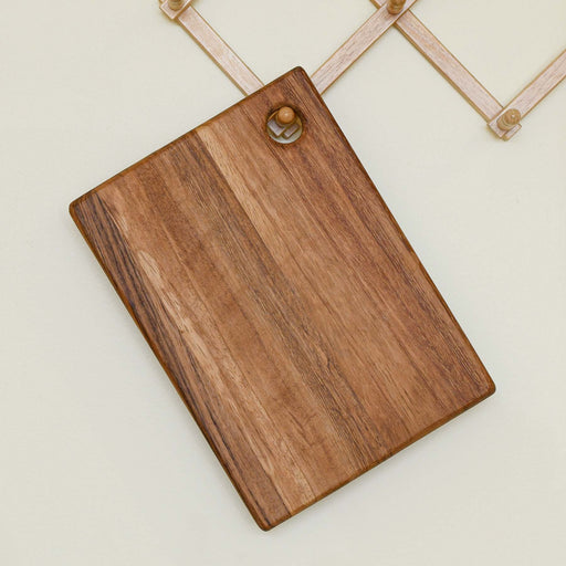 Small rectangular cutting board with a small hole for hanging. Made of caro caro wood.