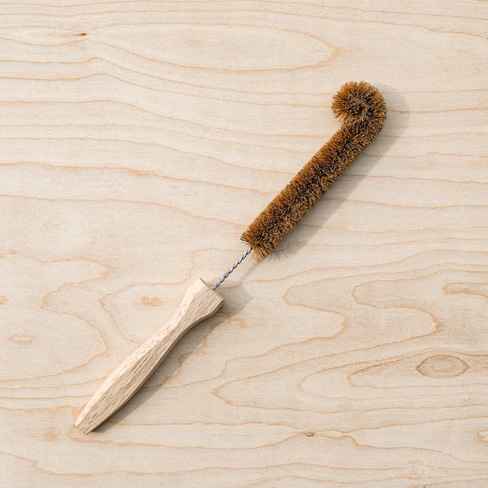 Coconut coire bottle brush with wooden handle.