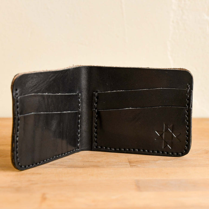 Handmade leather wallet in black. Made in the mountains of Boone, NC,