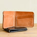 Handmade leather wallets in natural and black. Made in the mountains of Boone, NC,