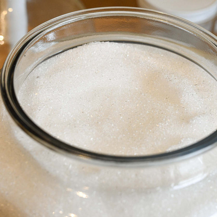Bulk epsom salt in a glass jug. Zero waste bath salt. 