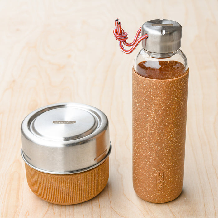 Glass lunch bowl with corresponding glass and cork water bottle. From Black and Blum.