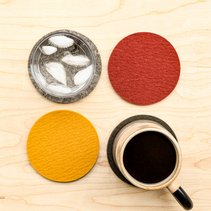 Various colored wool felted coasters, round. From Graf Lantz. 