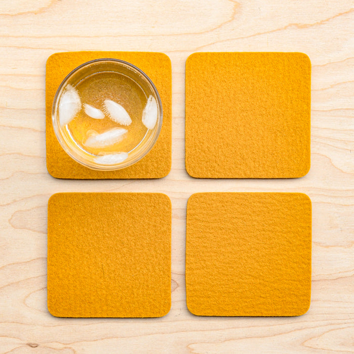 Turmeric square colored wool felted coasters from Graf Lantz.