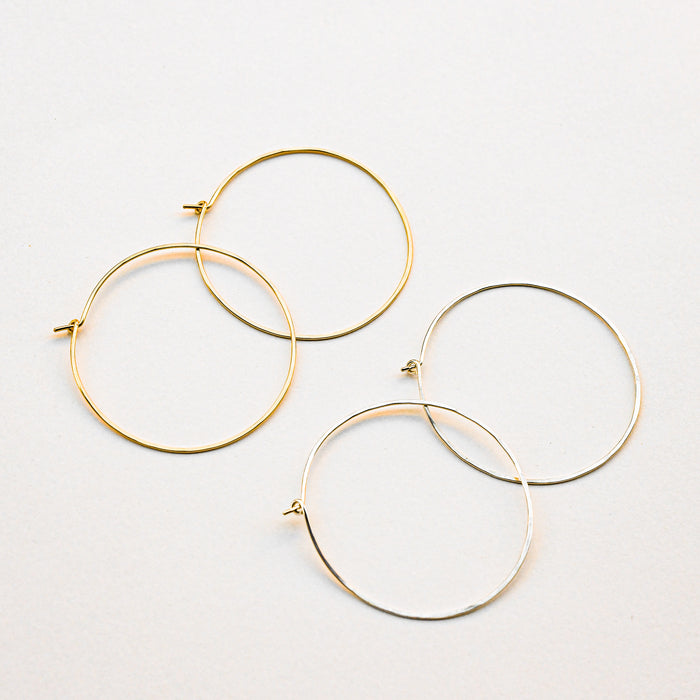 Gold and Silver pairs of hoop earrings. Handmade in Asheville, NC. 