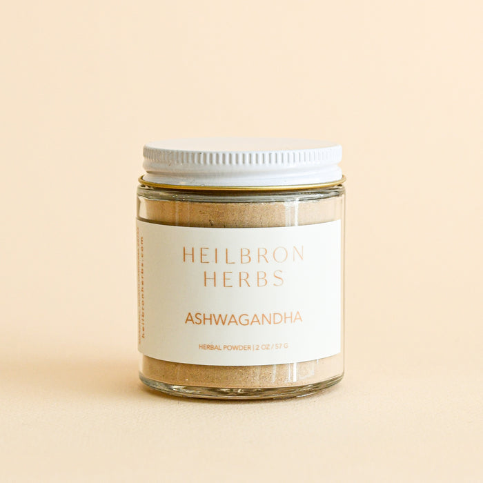 2 oz jar filled with ashwagandha powder. White lid and label. From Heilbron Herbs.