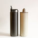 Two tall reusable stainless steel water bottles with flip straw spout for easy drinking.One in Black and one in beige grey gray. From Kinto.
