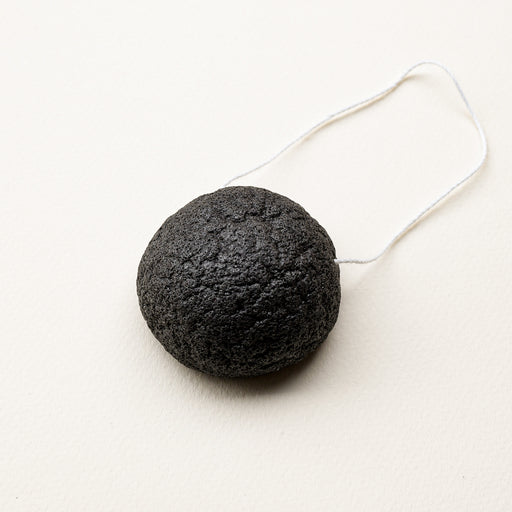 Round konjac face sponge with string to hang. Compostable. 