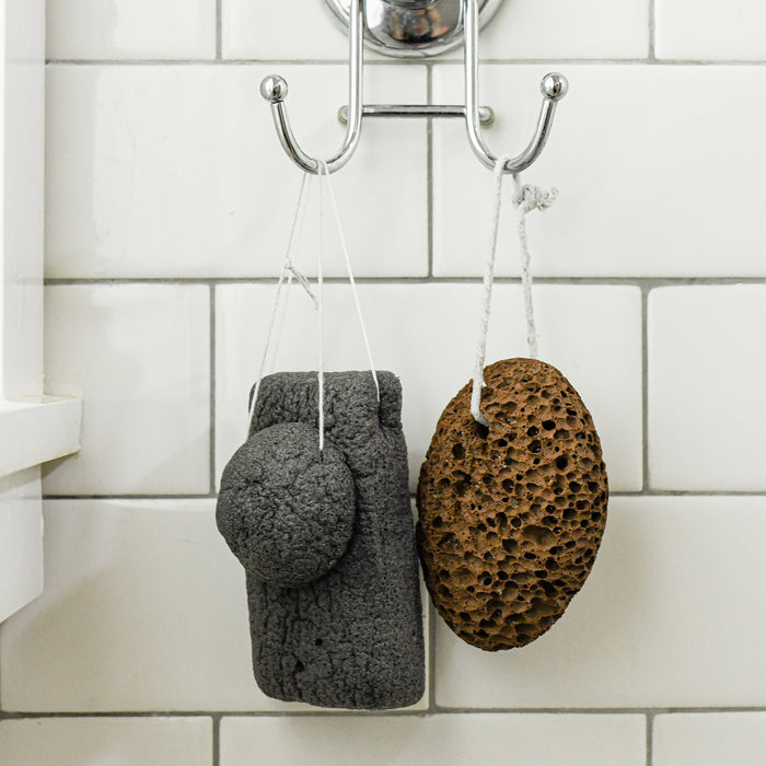 Lava stone with konjac face and body sponges in shower, Compostable. 