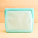 Stasher silicone medical and food grade safe reusable plastic bags. Mid stand up in Aqua.