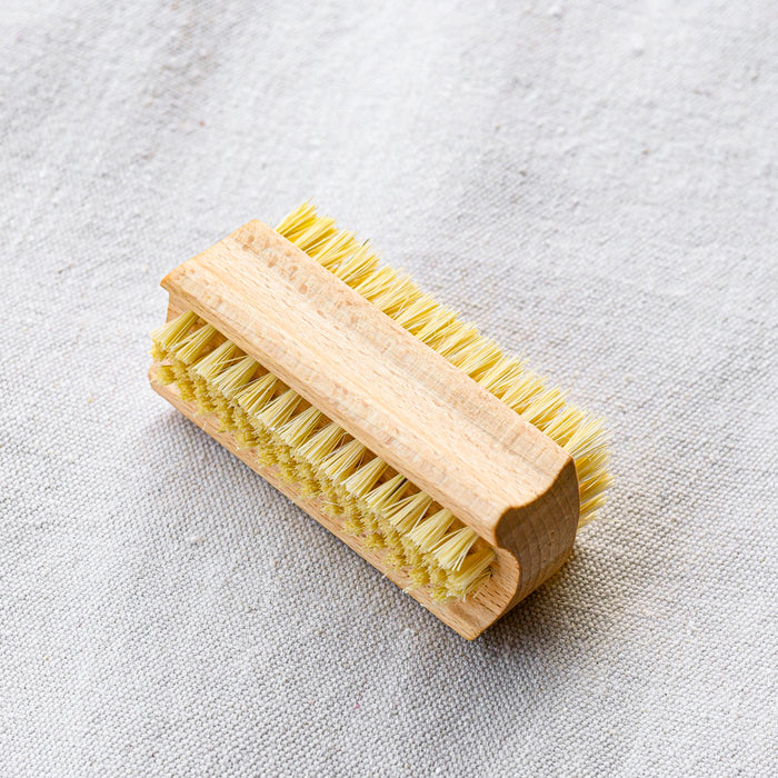 Plant fibers and beechwood double sided nail brush. 