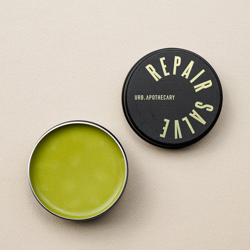 Green colored Repair Salve in black screw top tin from Urb Apothecary. 