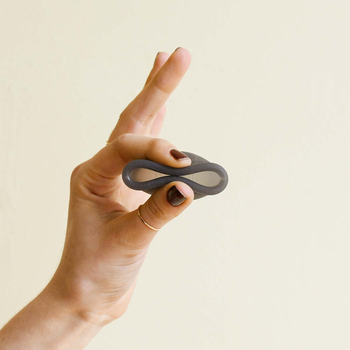 Menstrual cup bent for insertion. From Saalt. 