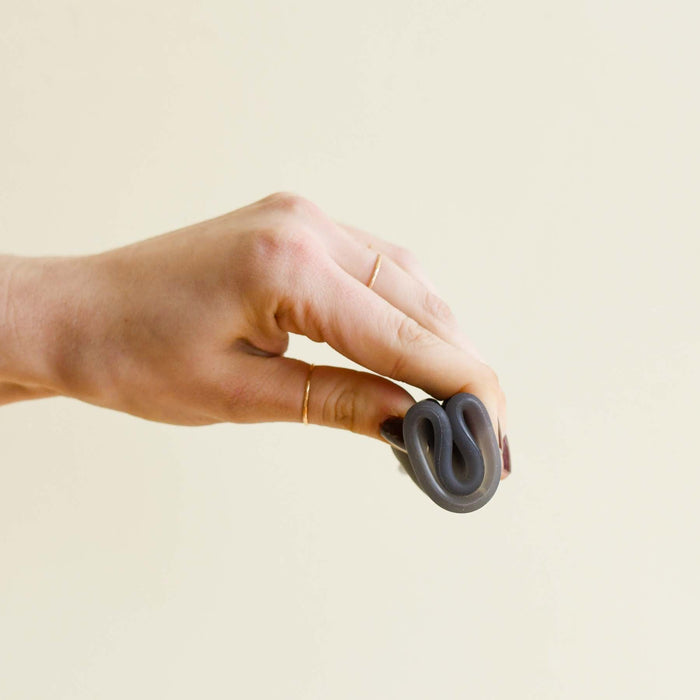 Menstrual cup folded for insertion. From Saalt. 