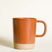 Terracotta ceramic mug.
