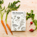 Six Seasons: A New Way with Vegetables cookbook surrounded by carrots and radishes. 
