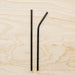 Black stainless steel straws in bent and straight form. 