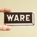 Ware logo sticker, transluscent background. 